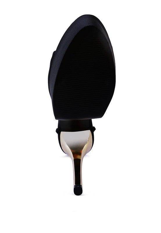 Sleek black bottom view of dramatic lace-up high heels with a stylish stiletto heel design