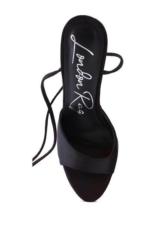 Dramatic lace-up high heels in black with sleek design and stylish straps for women's evening wear