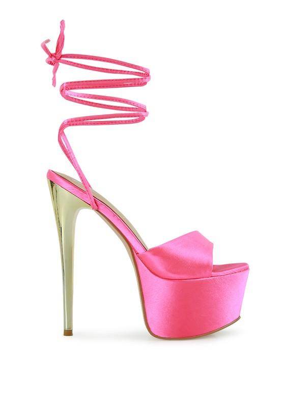 Dramatic lace-up high heels in vibrant pink with a stylish platform and stiletto heel