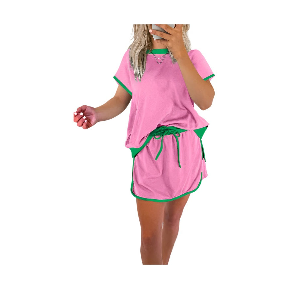 YNIQUE drop shoulder casual summer set in pink with green trim featuring a loose top and drawstring skirt