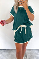 YNIQUE drop shoulder casual summer set in green with white trim featuring a loose top and drawstring skirt