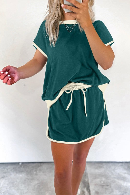 YNIQUE drop shoulder casual summer set in green with white trim featuring a loose top and drawstring skirt