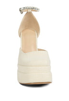 Women's embellished ankle strap heels in cream with a platform design