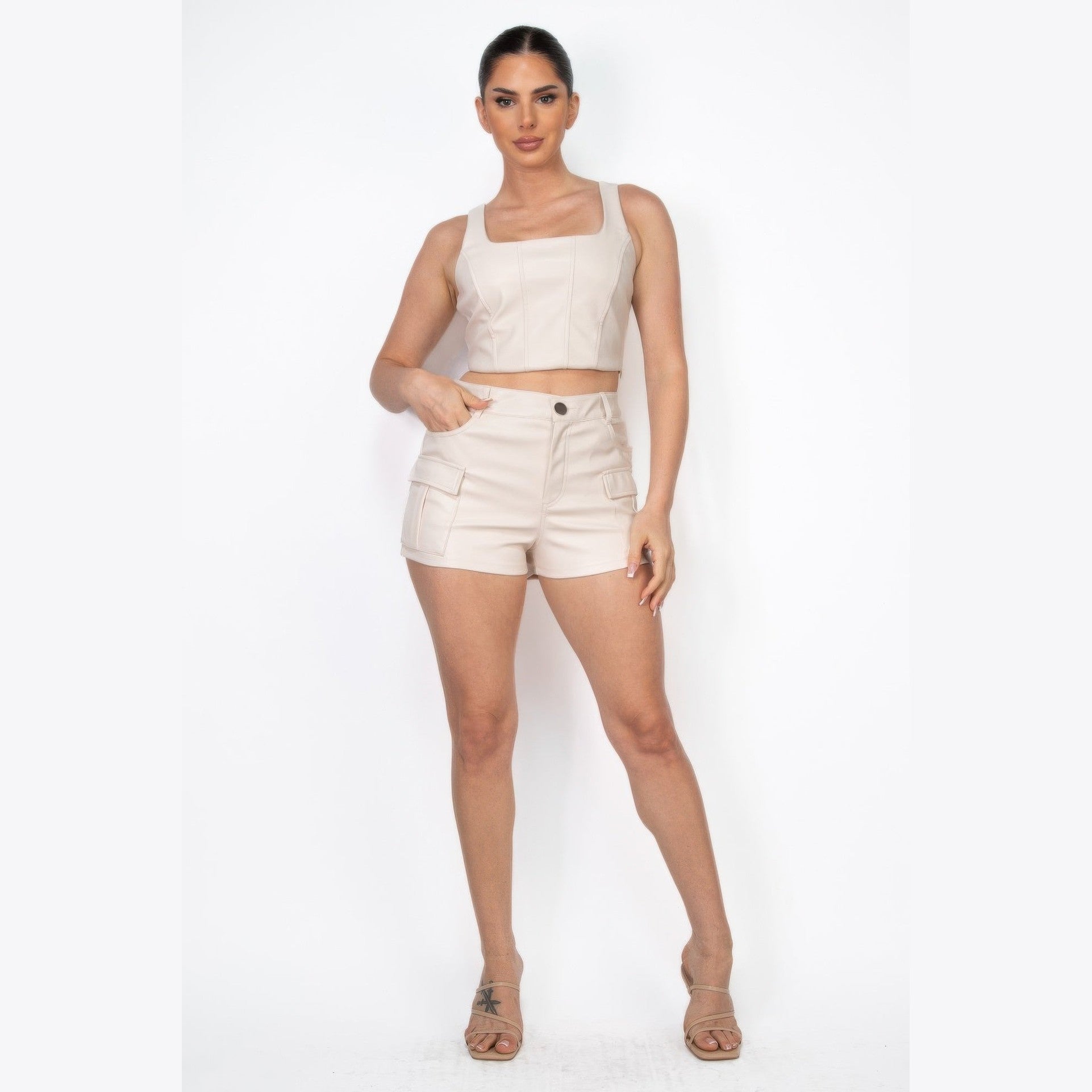 VacationGrabs beige faux leather cargo shorts women styled with matching crop top and sandals