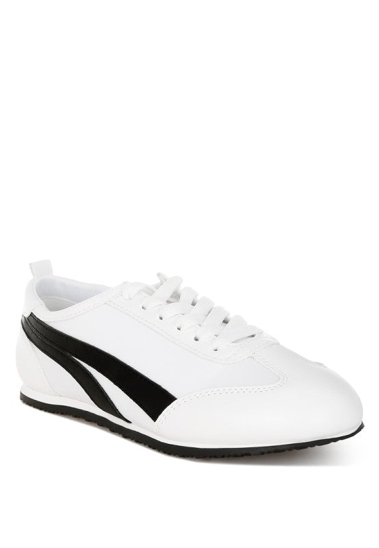 Women's faux leather lace-up sneakers in white and black for casual wear