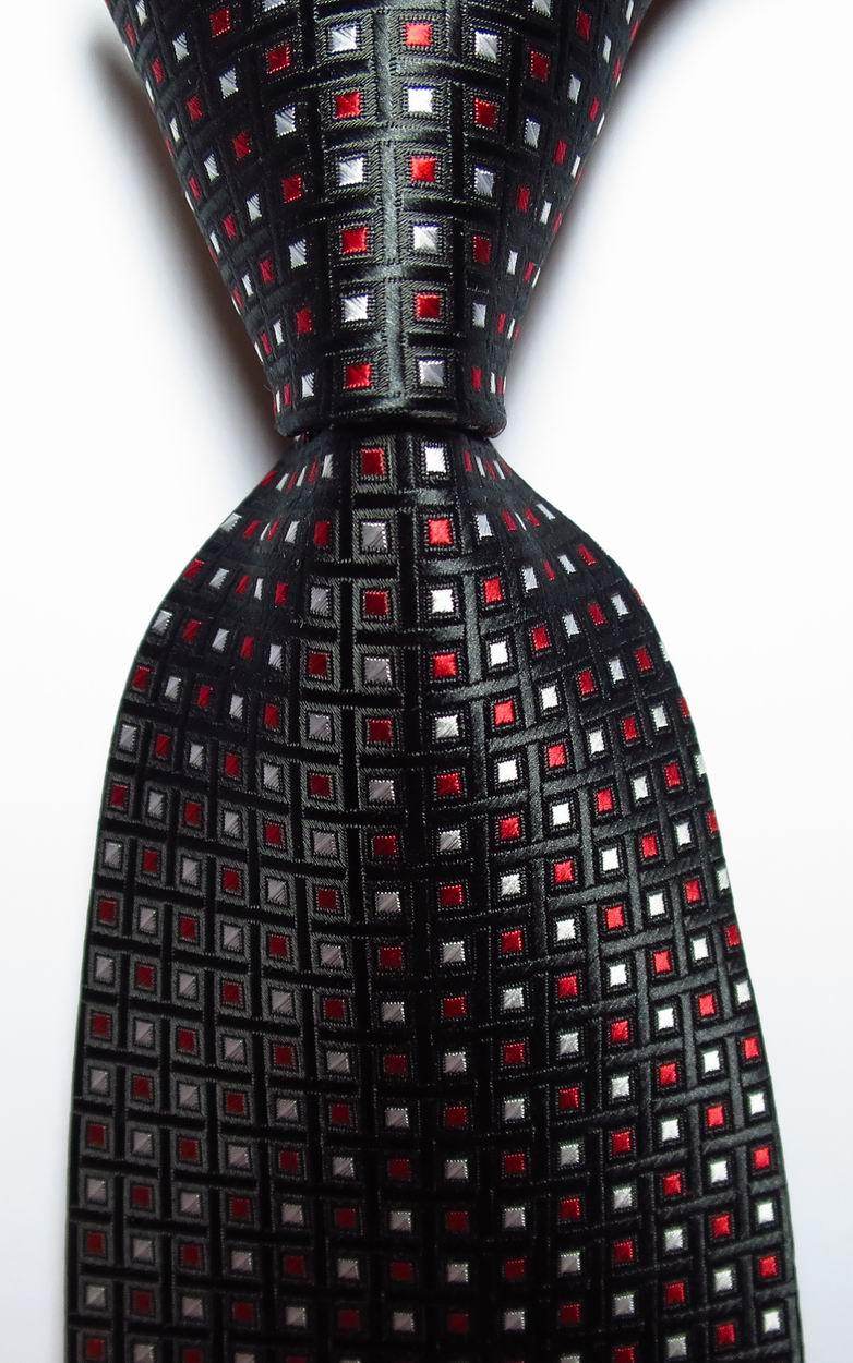Stylish black necktie with red and silver square pattern, part of a gold green necktie set