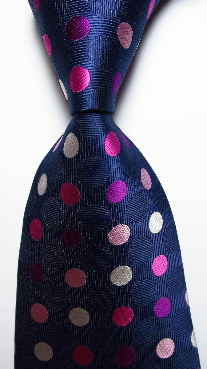 Stylish gold green necktie set featuring vibrant polka dots on a navy background
