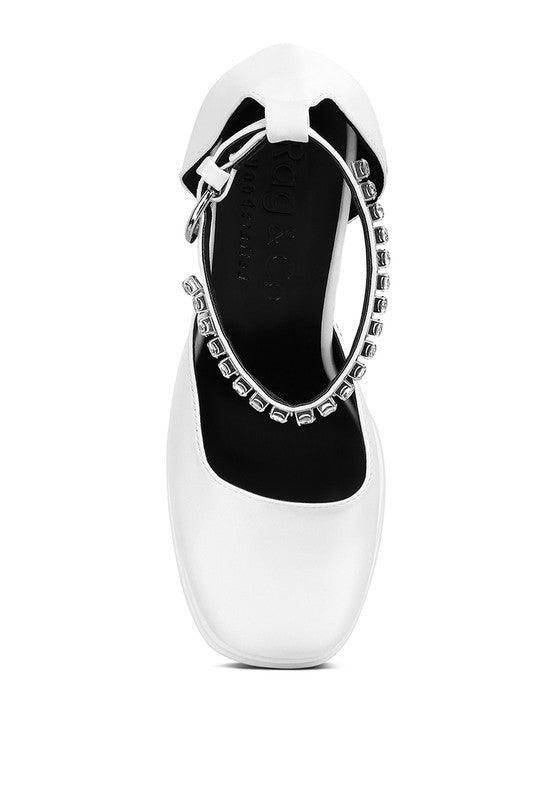 Elegant white heels with a silver ankle strap, perfect for pairing with the Green Martini Sandals