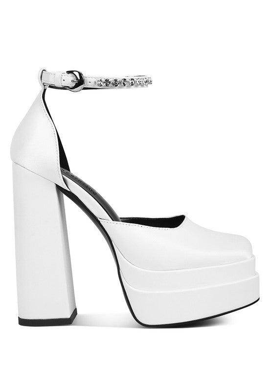 White platform heels with ankle strap, perfect for pairing with Green Martini Sandals for a stylish look
