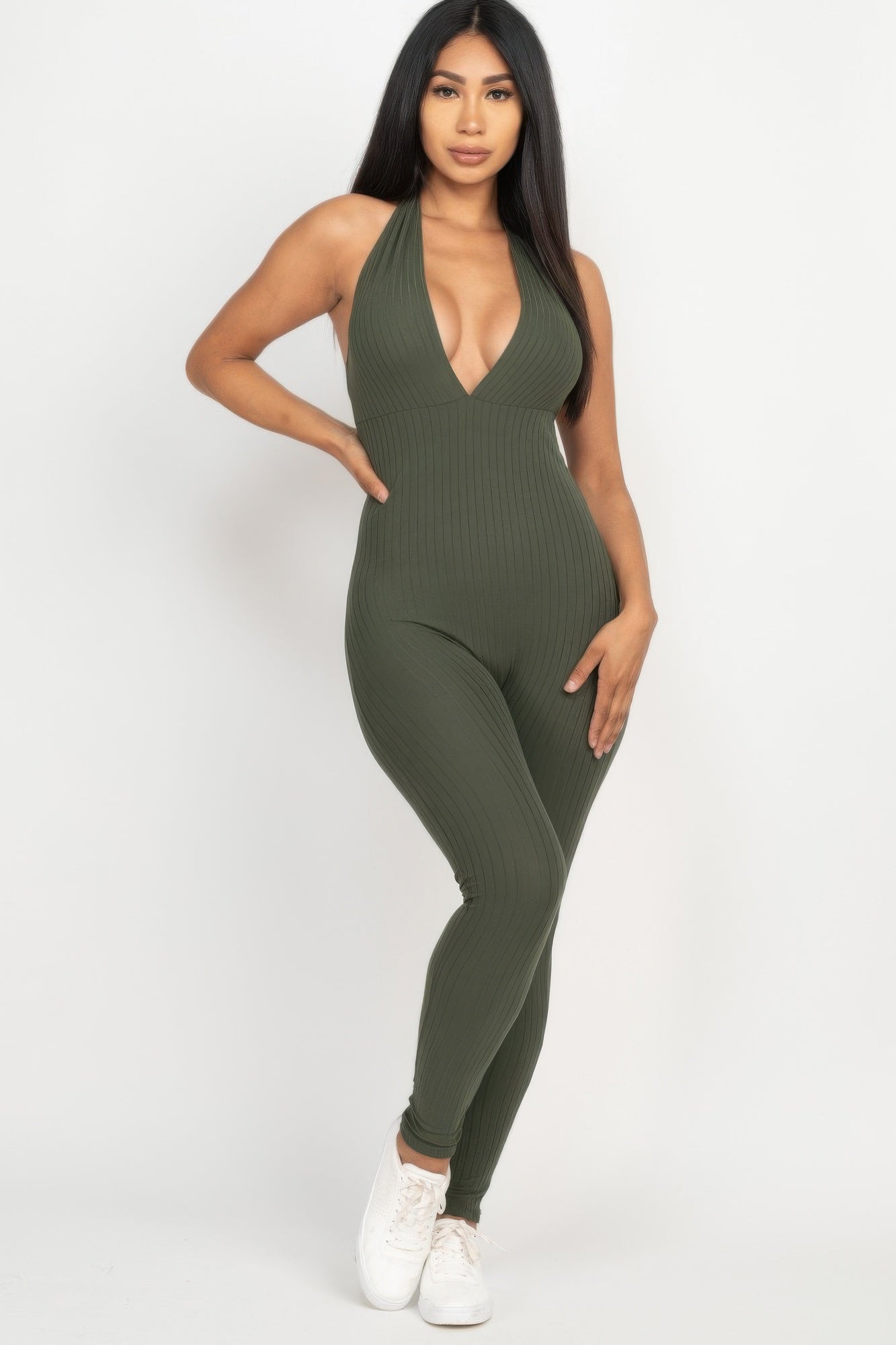 Green ribbed bodycon jumpsuit for women featuring a halter neckline and form-fitting silhouette