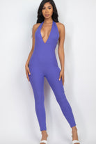 Vibrant purple ribbed bodycon jumpsuit for women with a plunging neckline and fitted silhouette