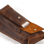 Leather travel backpack for men featuring a spacious interior and a magnetic closure pocket for easy access