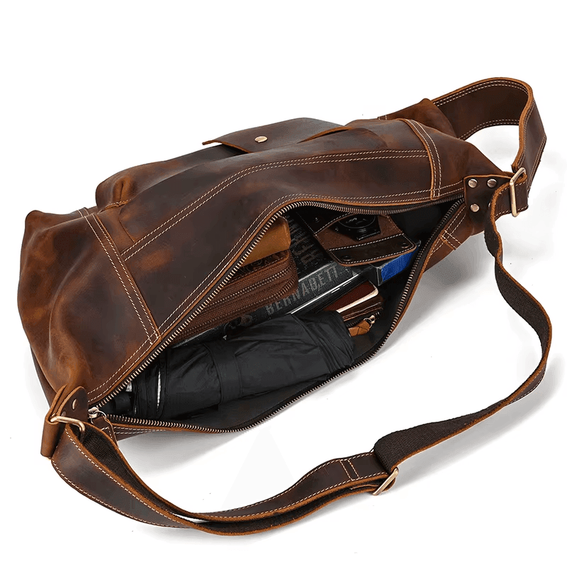 Brown leather travel backpack for men with spacious interior and stylish design