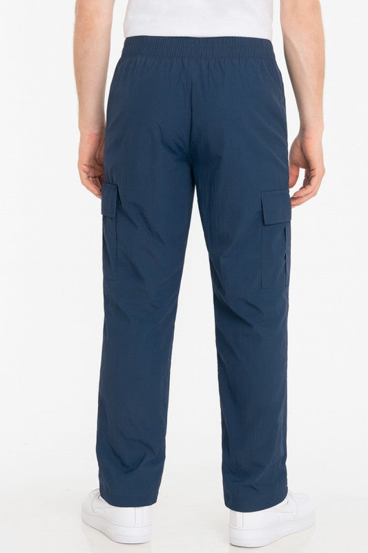 Navy nylon cargo pants for men, ideal for casual outings