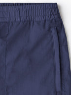 Navy nylon cargo pants for men, versatile for outdoor wear