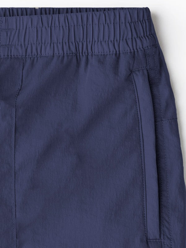 Navy nylon cargo pants for men, versatile for outdoor wear