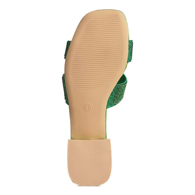Bottom view of green rhinestone cross strap sandals with a flexible sole for comfort