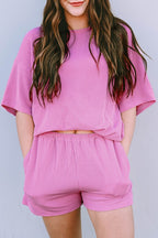 Pink ribbed textured matching set for women with short sleeves and elastic waist shorts