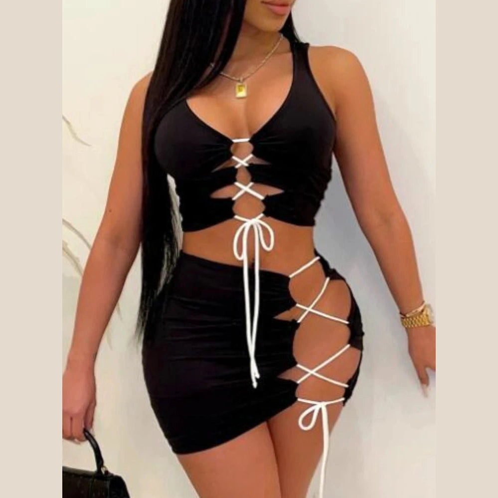 VacationGrabs sexy club mini dress with black fabric and white lace-up detailing on front and side