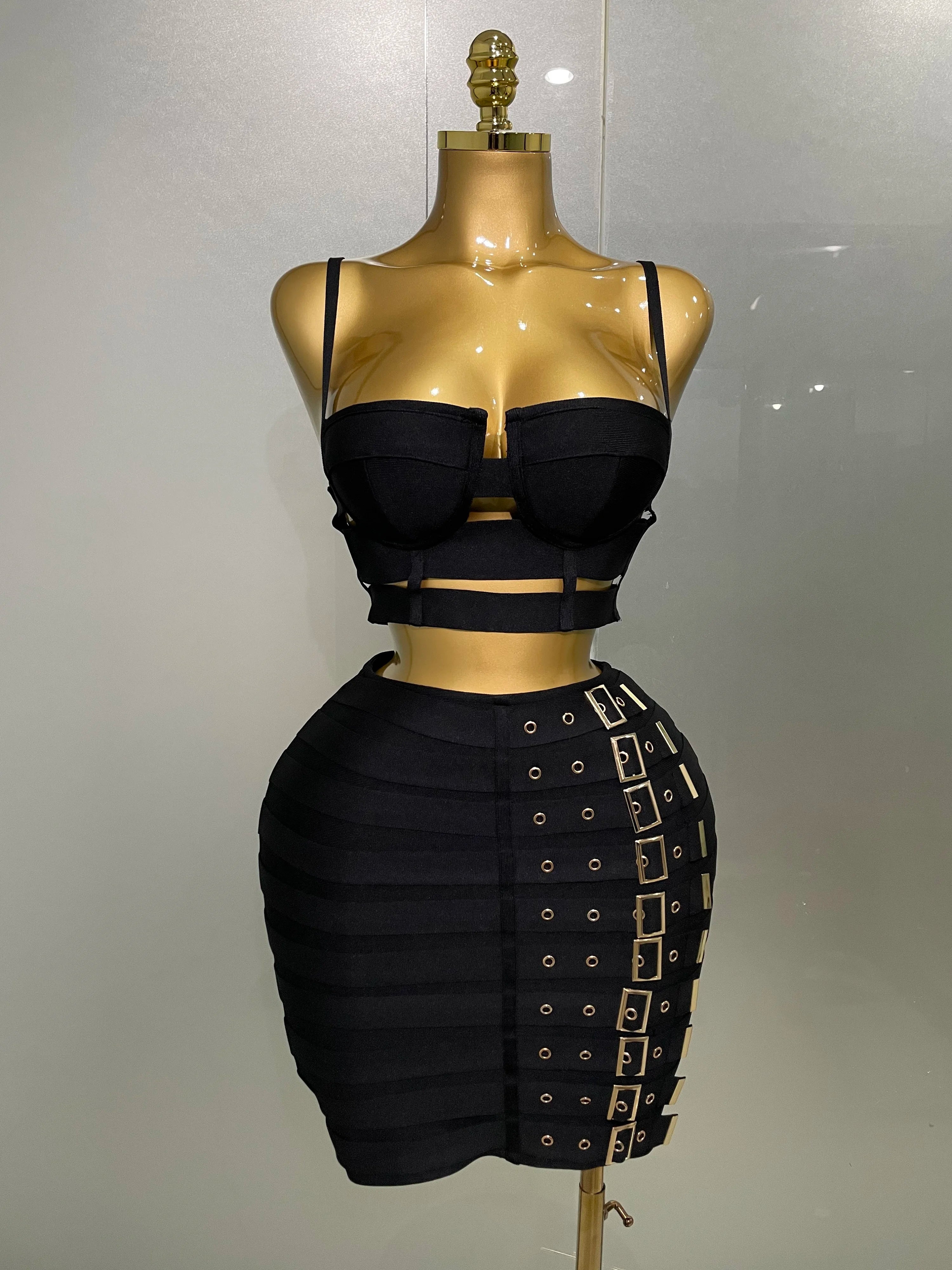 Black bandage sexy club outfit for women with strappy crop top and buckle detail skirt
