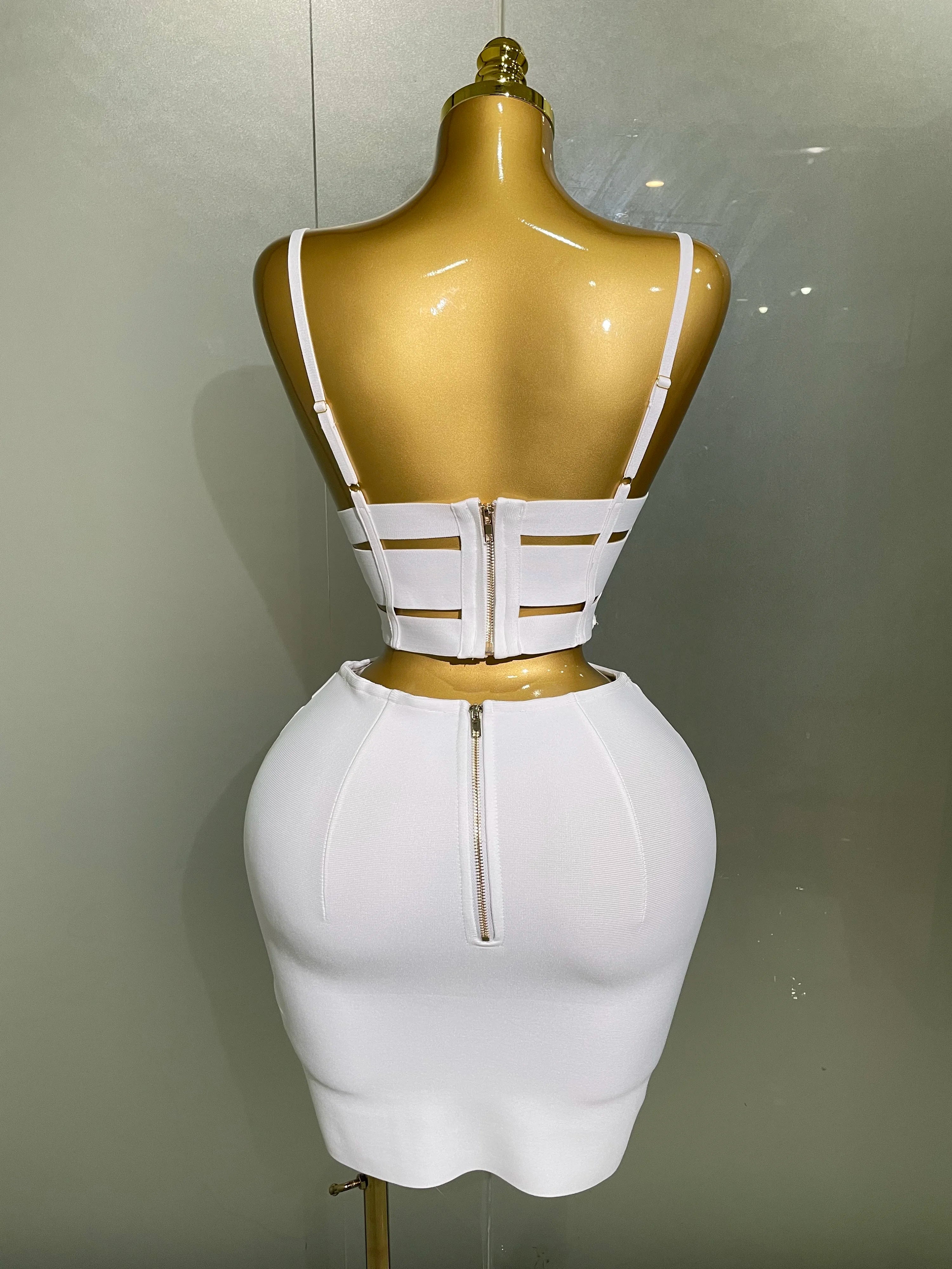 Back view of a white sexy club outfit for women with cut-out straps and zipper details on a mannequin
