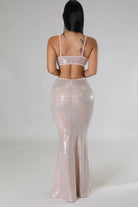 Woman wearing a shiny two-piece sexy vacation maxi dress with thin straps from VacationGrabs