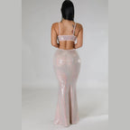 Woman wearing a shiny two-piece sexy vacation maxi dress with thin straps from VacationGrabs