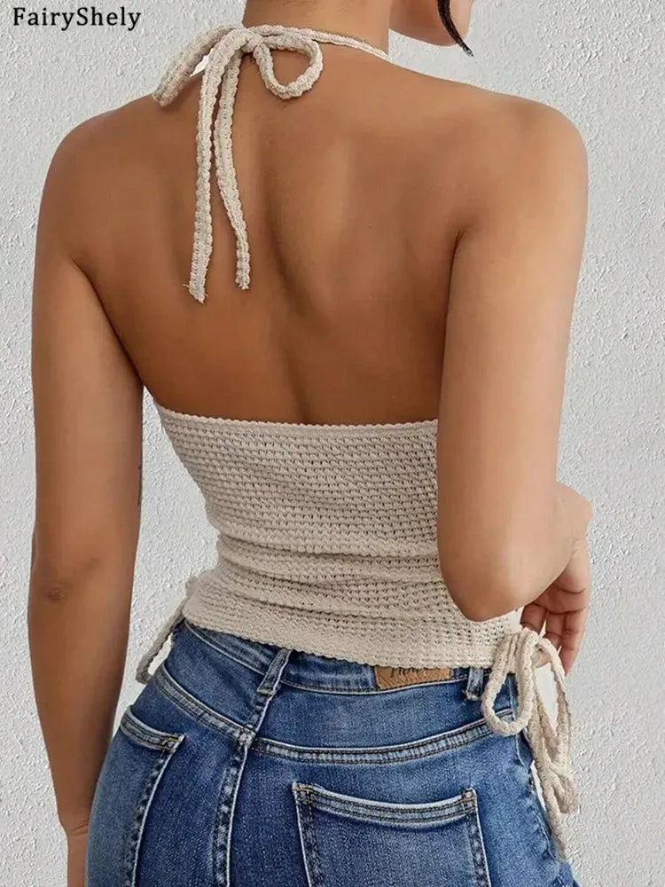 Back view of a woman wearing a beige sleeveless bodycon halter top for women paired with blue jeans