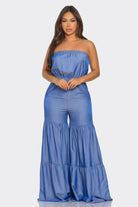 Stylish strapless vacation jumpsuit in blue with flared legs and a relaxed fit for warm weather outings