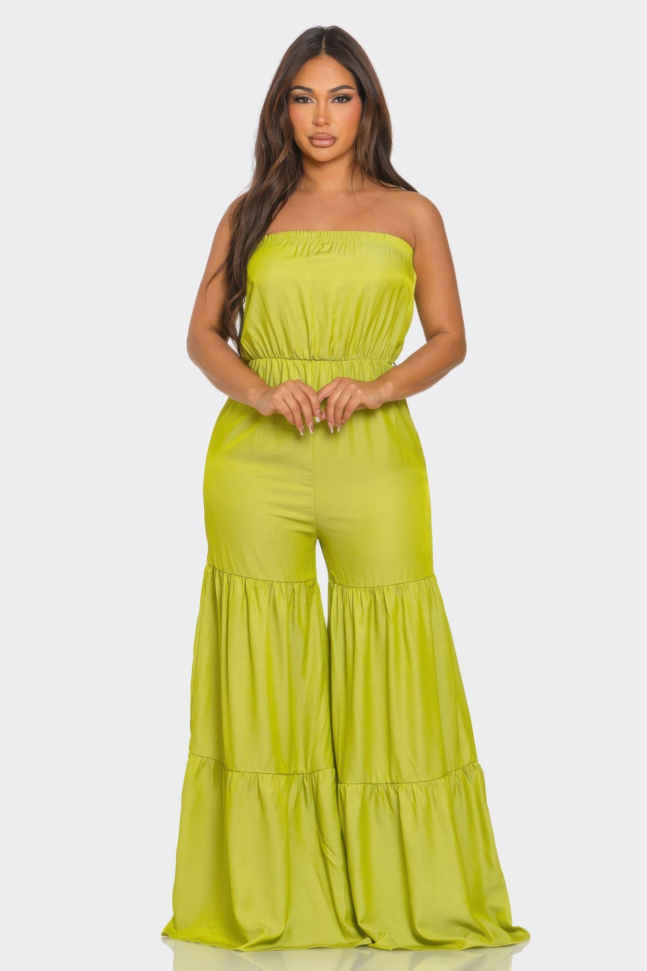 Bright green strapless vacation jumpsuit with flowing wide-leg design and elastic waistband