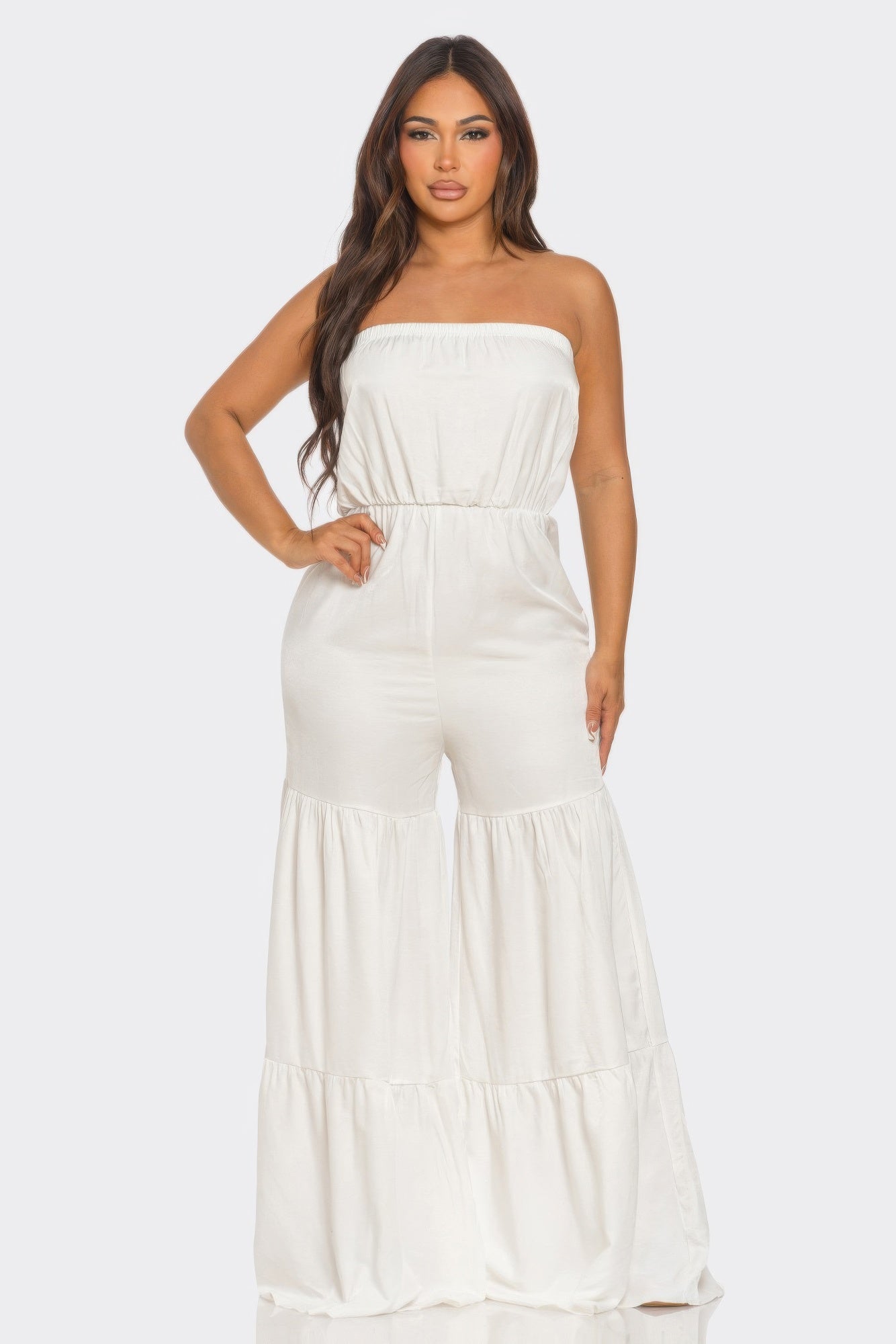 Elegant white strapless vacation jumpsuit with flowy wide legs for a stylish summer look