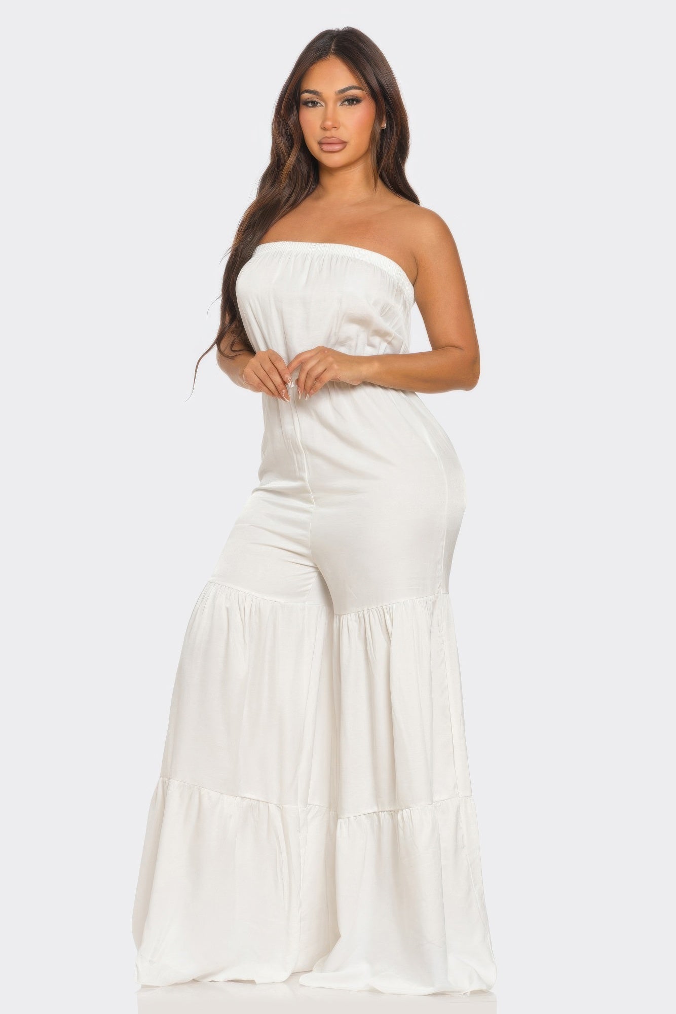 White strapless vacation jumpsuit with tiered design for summer outings and beach days