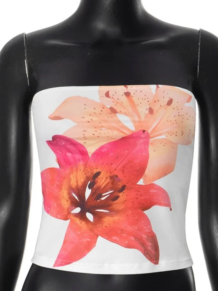 VacationGrabs summer strapless crop top with large pink and orange flower print on white fabric
