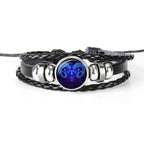 Unique zodiac sign wristbands for men featuring braided leather and a blue ram emblem