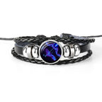Unique zodiac sign wristbands in black leather with a vibrant astrological symbol centerpiece