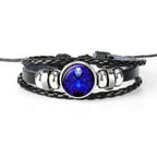 Unique zodiac sign wristbands featuring a braided design and a colorful zodiac charm