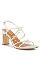 White strappy heel sandals from Rag Company, perfect for vacation style sandals with a chic design.