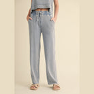 Womens relaxed fit mineral wash trousers in light blue with elastic waistband and drawstring by VacationGrabs