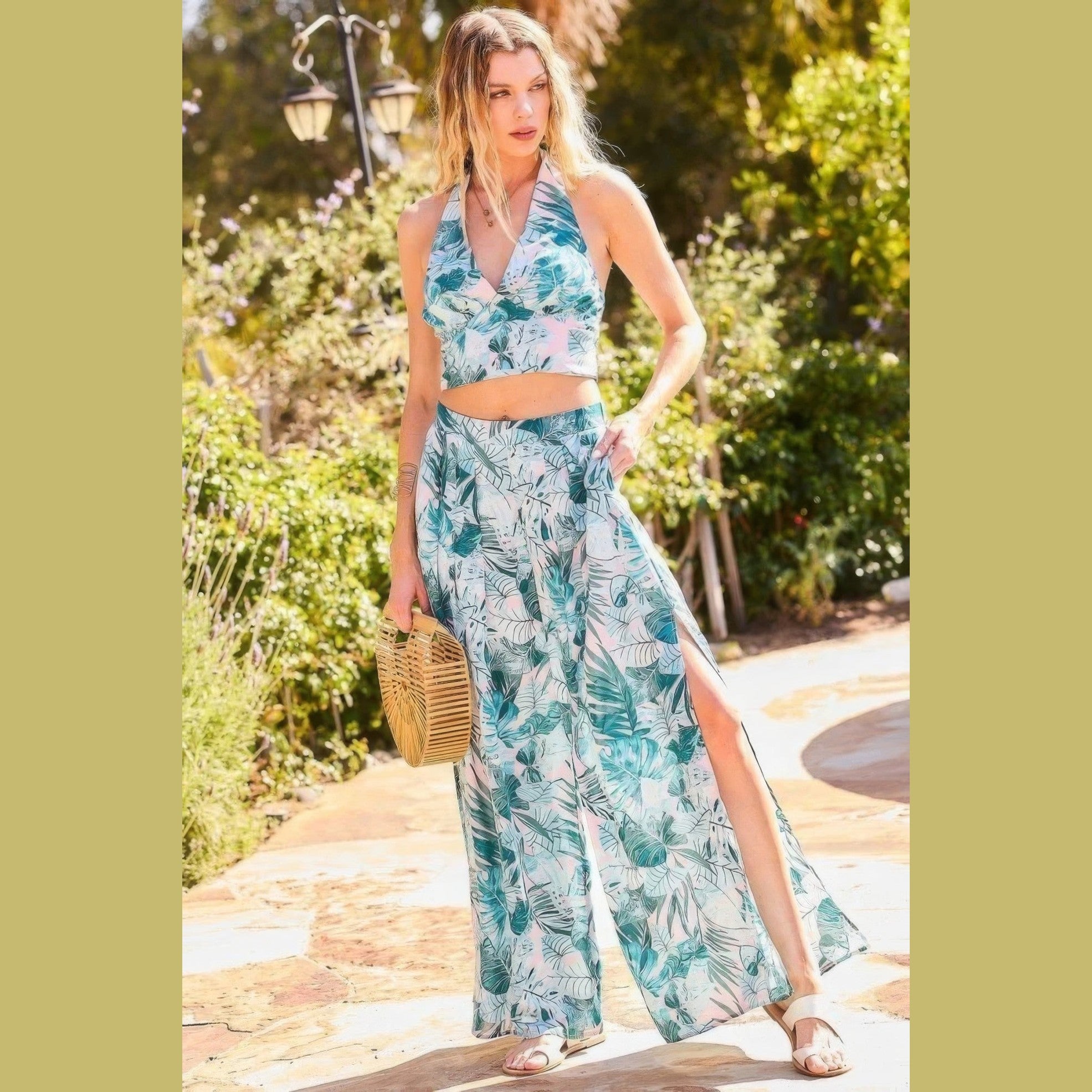 VacationGrabs women's vacation pants with tropical leaf print and side slit styled with matching halter top