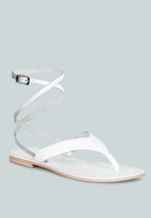 Stylish white wrap up tie flat sandals with ankle straps for casual summer wear