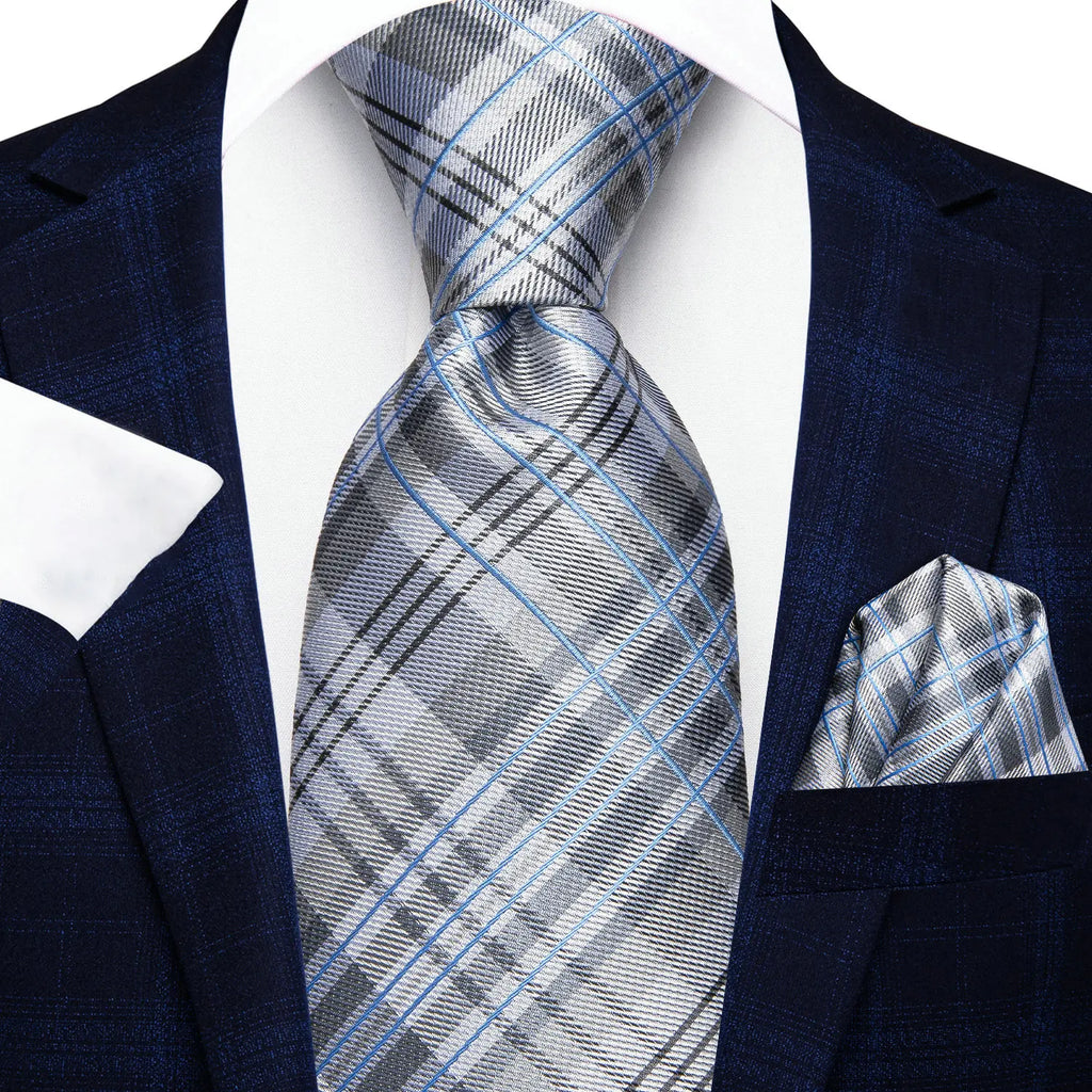 Men's blue plaid suit with a white pocket square, learn how fold a pocket square