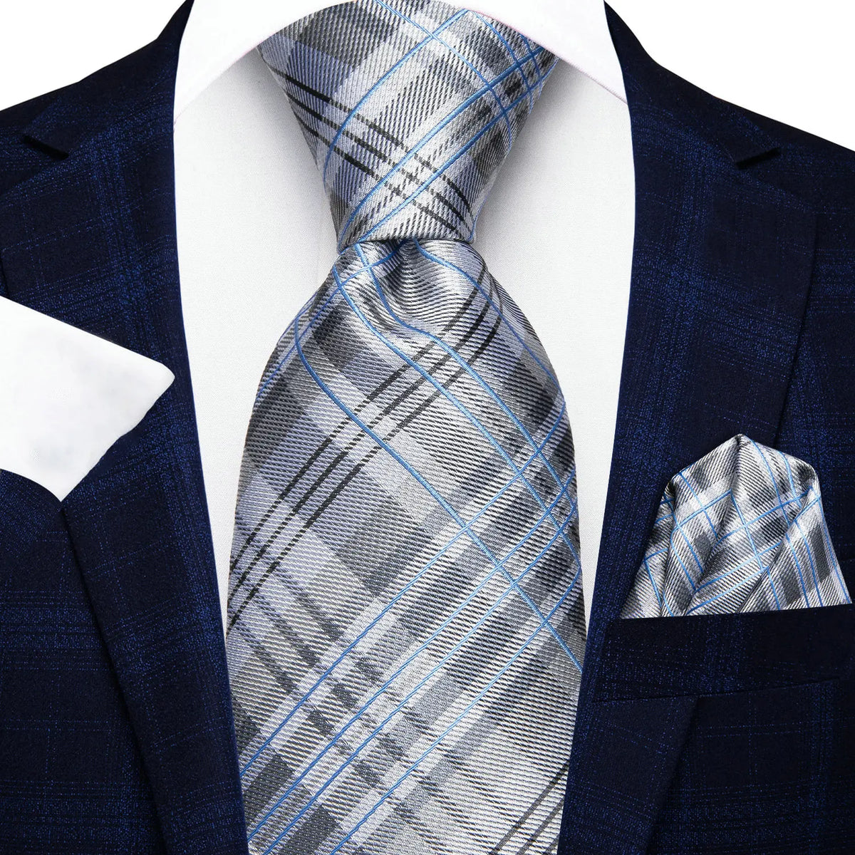 Men's blue plaid suit with a white pocket square, learn how fold a pocket square