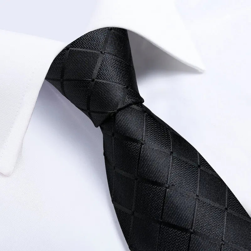 Black patterned men's tie, perfect for formal occasions, learn how to tie men's tie
