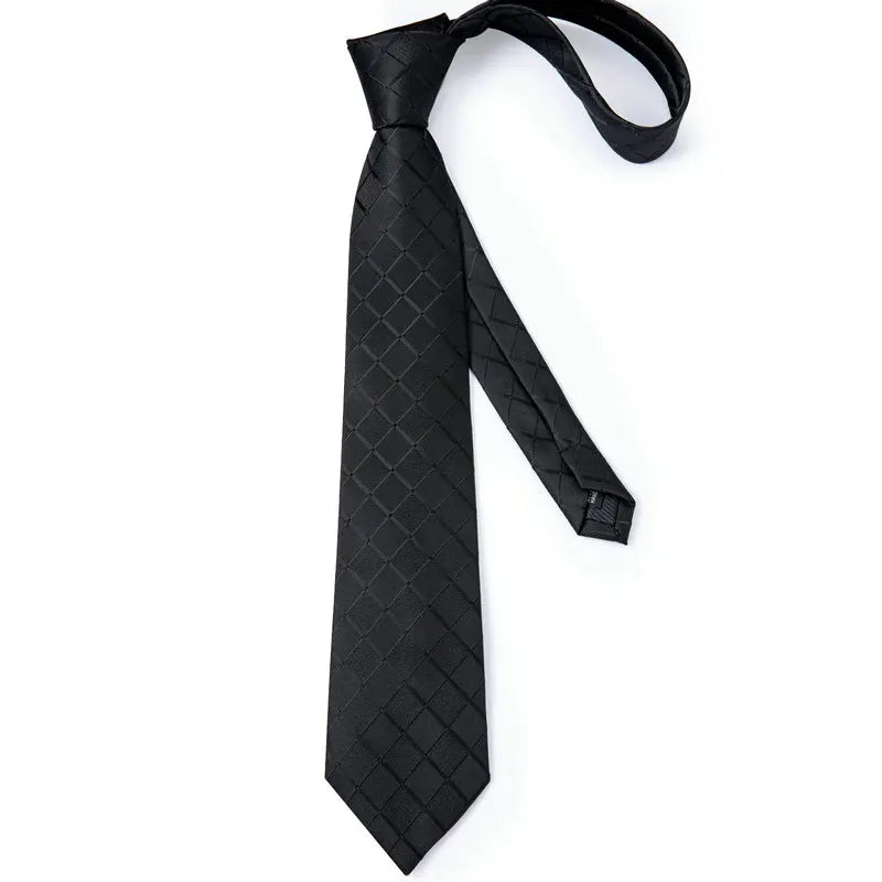 Black men's tie with geometric pattern, perfect for how to tie men's tie
