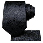 Black patterned tie with elegant design, perfect for formal occasions
