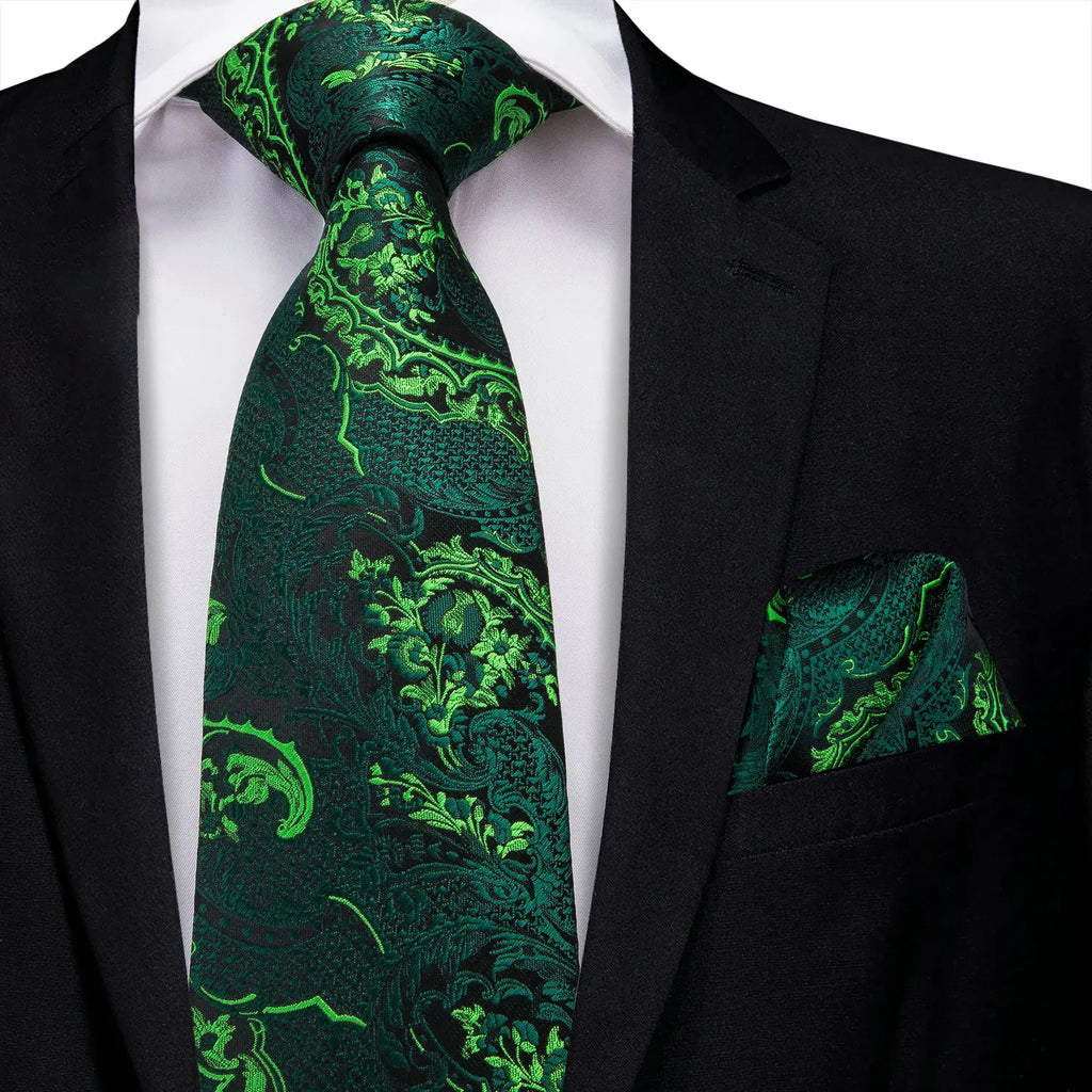 Green patterned silk tie and matching pocket square for formal attire