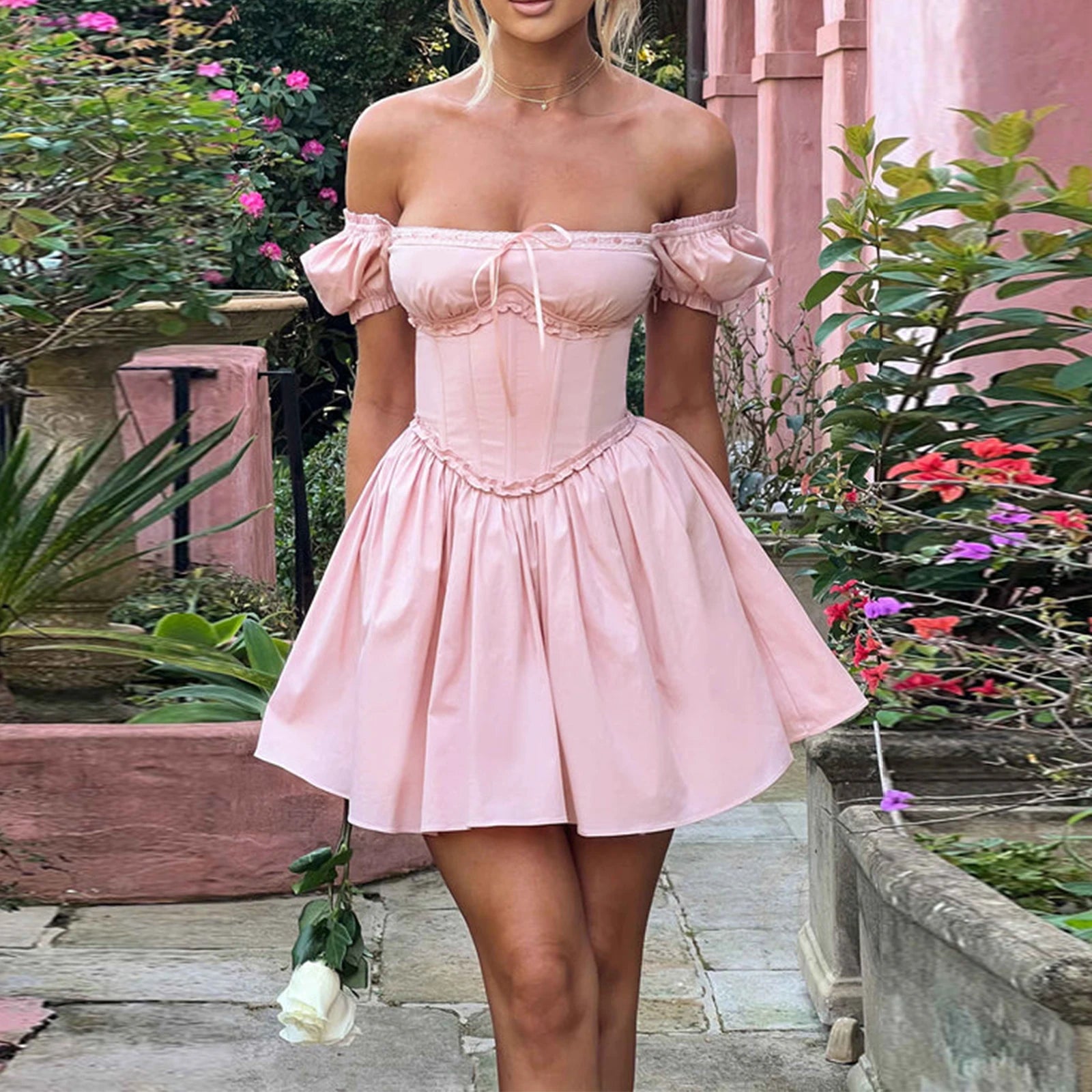 Vintage bridal dress in blush pink with off-shoulder sleeves for weddings