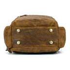 Bottom view of a vintage leather backpack with metal studs for durability and style