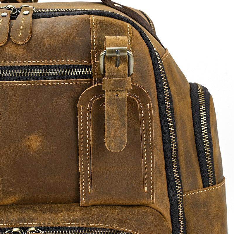 VacationGrabs vintage leather backpack with multiple zippered compartments and durable straps