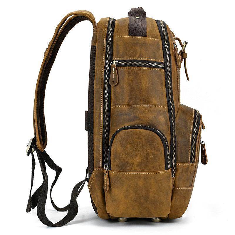 Side view of a vintage leather backpack with multiple pockets and sturdy straps for stylish travel